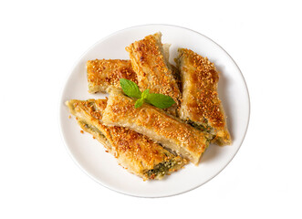 Greek cuisine dishes; spanakopita Sesame on handmade spinach feta cheese pie in the oven. Turkish name; ispanakli borek