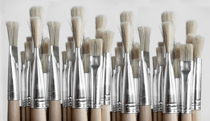 Paint brushes isolated on 
off-white background