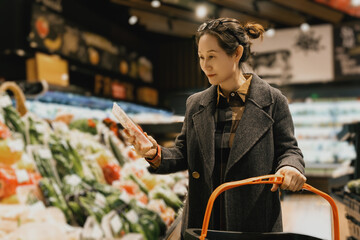 Woman Selecting Products in Grocery Store Aisle