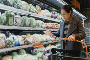 Woman Selecting Fresh Produce at Grocery Store