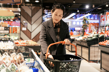 Young Woman Choosing Products in Supermarket