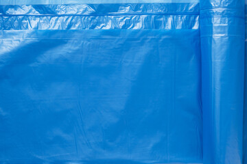Blue plastic wrinkled bag texture and background