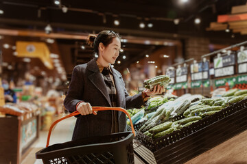 Businesswoman Choosing Fresh Produce in Supermarket