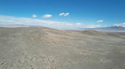Fototapeta na wymiar Scenic desert with hills against the background of a blue sky. Nevada, USA