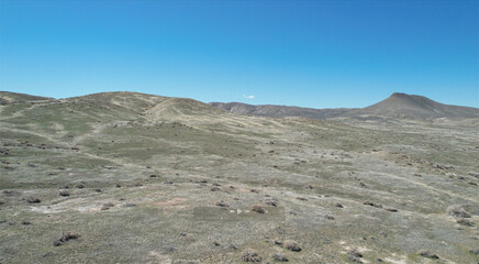 Scenic desert with hills against the background of a blue sky. Nevada, USA