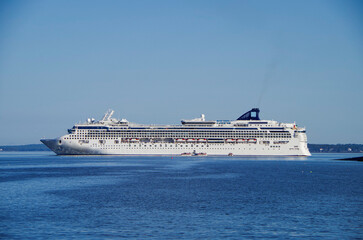 Large family cruiseship cruise ship liner Dawn anchoring in Bar Harbour Bay on sunny blue sky day...