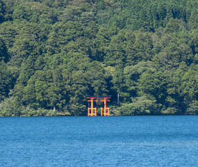 A“red gate of peace” (heiwa no torii) in Hakone-jinja shrine standing proud and tall in Ashinoko Lake, Kanagawa prefecture, Japan 