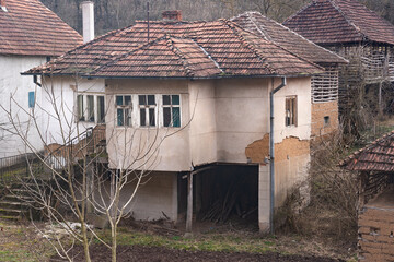 Old dilapidated houses in an abandoned mountain Serbian village in southeastern Serbia, on the slopes of Suva Planina mountain.