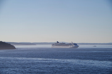 Large family cruiseship cruise ship liner Dawn anchoring in Bar Harbour Bay on sunny blue sky day...