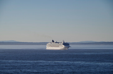 Large family cruiseship cruise ship liner Dawn anchoring in Bar Harbour Bay on sunny blue sky day...