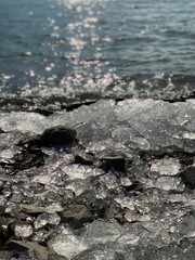rocks and ice in the water - 728512049