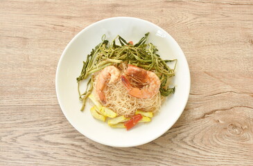 spicy fried rice vermicelli with shrimp and mimosa on plate