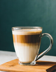 Coffee latte in a glass cup on dark background