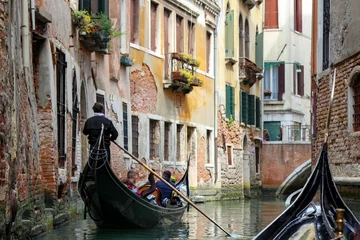 Tuinposter A Gondola Ride in Venice. Gondoliers On the Grand Canal. Venice Travel © Dmitry Koshelev