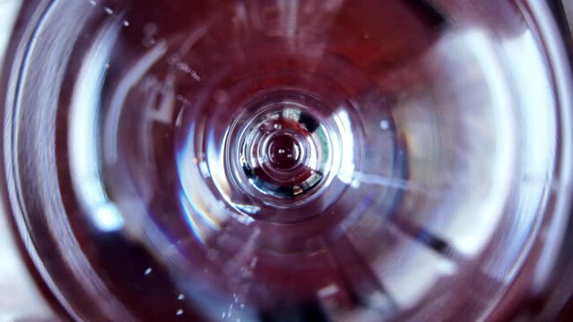 Slow motion pouring of mineral water on a glass close pu