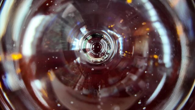 Slow motion pouring of mineral water on a glass close pu