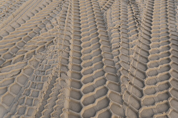 Fototapeta premium Wheel tracks in the sand