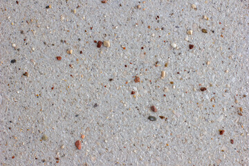 Small stones on a concrete surface, natural background
