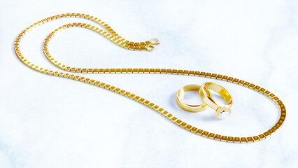 3D render of two golden wedding rings with golden chain isolated on grey background