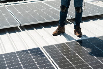 Male technician installing solar panel system outdoors Alternative solar cell storage and renewable energy. copy space, solar cell concept.