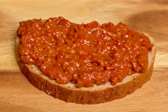 Zacusca, food made from eggplant on a slice of bread.