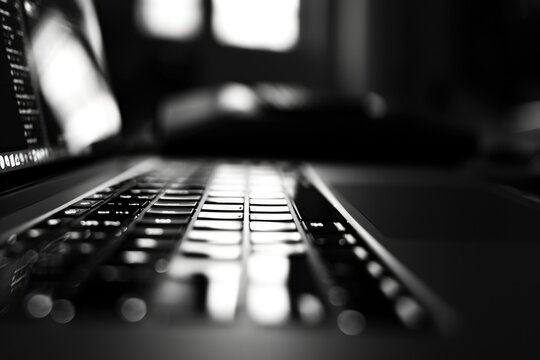 Fototapeta A black and white photo of a laptop. Suitable for technology-related projects