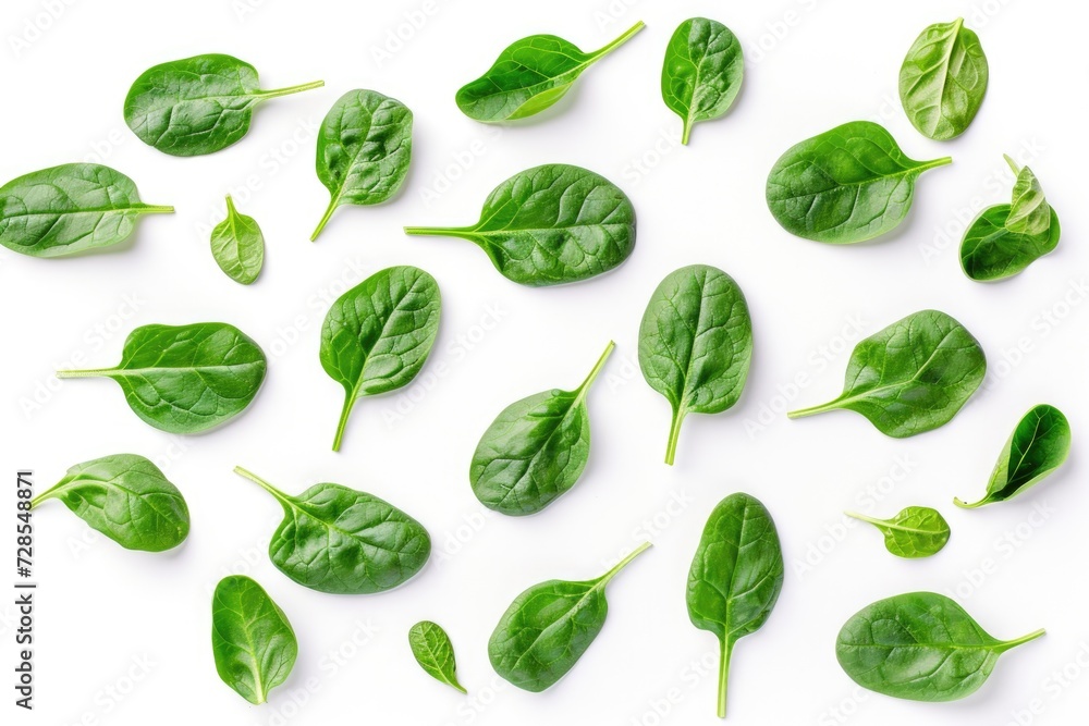 Poster Spinach leaves arranged in a group on a clean white surface. Suitable for food and health-related designs