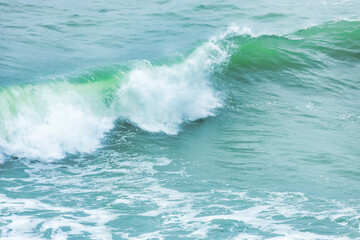 Wave splashing close-up. Crystal clear sea water, in the ocean in San Francisco Bay, blue water, pastel colors.