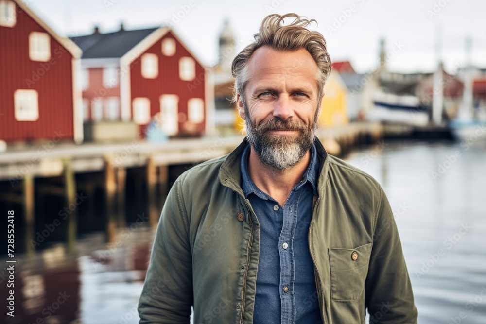 Aufkleber a man standing in front of a body of water. this versatile image can be used to represent tranquilit