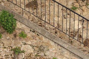 Сlose-up stone steps in the ancient antique city. Stone steps of a staircase close-up.