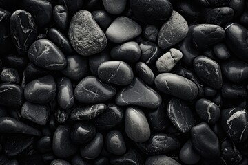 A black and white photo showcasing a pile of rocks. Ideal for adding a touch of simplicity and...