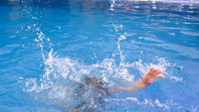 the child drowns in the water. Selective focus. kid.
