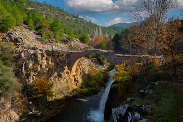 Fototapeta na wymiar Turkey's waterfalls and rivers. Historic stone bridge and waterfall. Clandras bridge and Clandras waterfall. Usak , Turkey