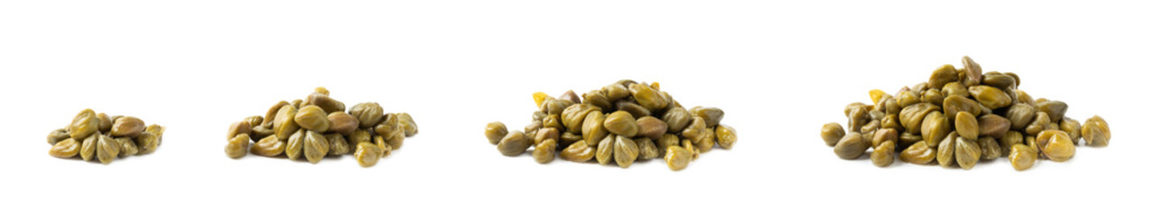 Capers isolated on white background. Marinated caper buds, small salted capparis in bowl, fermented food, pickled capers group.Organic spices and seasonings.