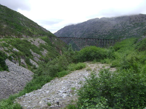 metal bridge over mountain valley