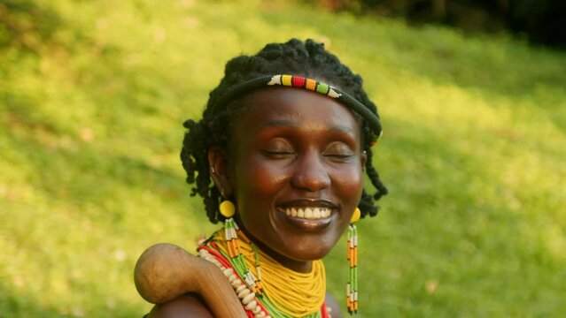 A Woman from the Karamojong Tribe Wearing a Smile in Uganda, East Africa - Close Up