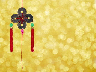 Chinese coins lucky charm on gold bokeh background