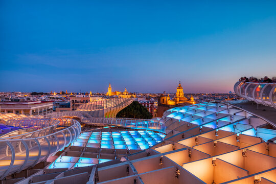 Seville City Skyline view with Illuminated Space Metropol Parasol in the Foreground at Dusk, Seville