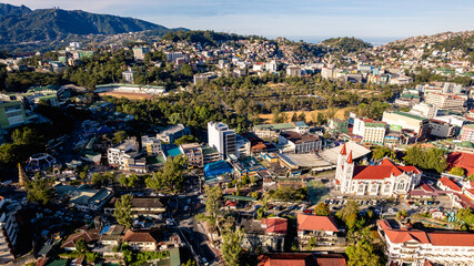 Baguio City, Philippines - Jan 16, 2024: Aerial of downtown Baguio, Burnham Park and the...