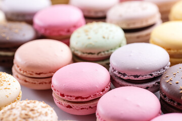 Fototapeta na wymiar Close-up view of assorted macarons in pastel colors, perfect for dessert recipes or bakery themes.