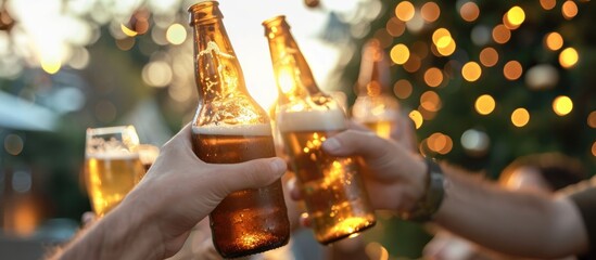 Close friends gather outdoors to celebrate the holidays, raising their beer bottles together, creating lasting bonds.