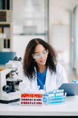 Modern medical research laboratory. female scientist working with micro pipettes analyzing...