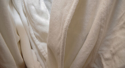 Close up view of plush terry cloth bathrobe hanging on hook inside bathroom of cabin stateroom...