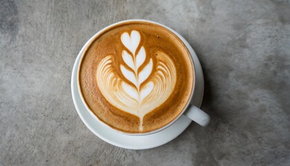 top view of hot coffee cappuccino latte art top view on concrete table background