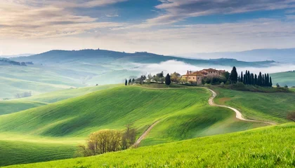 Cercles muraux Toscane amazing spring landscape with green rolling hills and farm houses in the heart of tuscany in morning haze