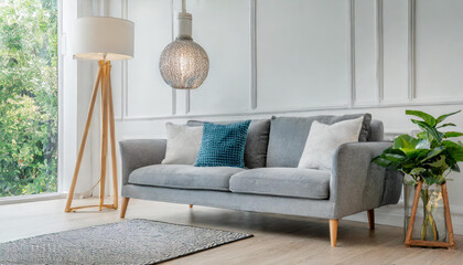 grey sofa and lamp in white living room,