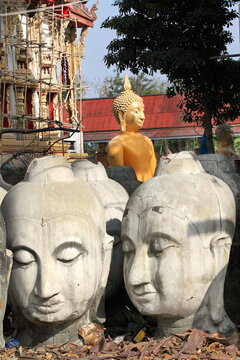 Buddha statue, in front of rebuilt temple in Thailand