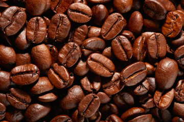 Large group of roasted Arabica coffee beans. Background. Top view.