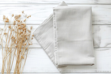 Top view with gray kitchen napkin isolated on table background. Folded cloth for mockup with copy space, Flat lay. Minimal style.