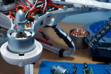 Disassembled UAV quadcopter for repair.